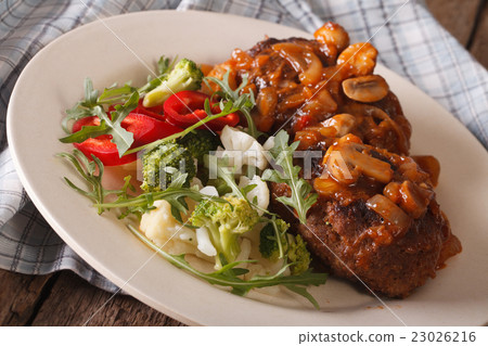 Salisbury steak with vegetable salad close-up Salisbury steak with vegetable salad close-up 23026216