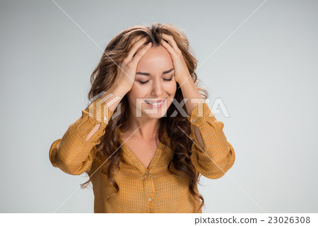 The young woman's portrait with pain emotions The young woman's portrait with pain emotions 23026308