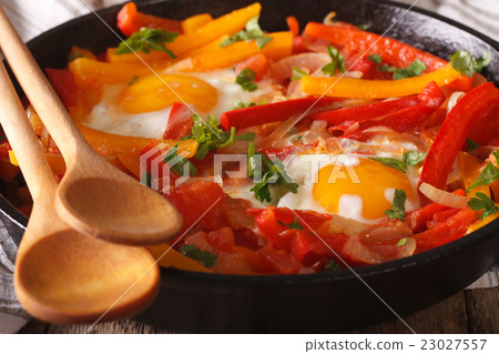 traditional Basque piperade with eggs close-up 23027557