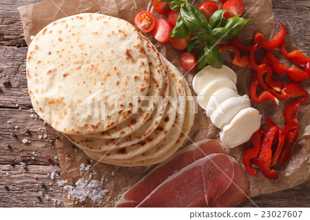 Italian freshly baked piadina with ingredients 23027607