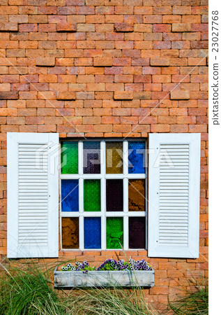 Window on orange brick wall 23027768