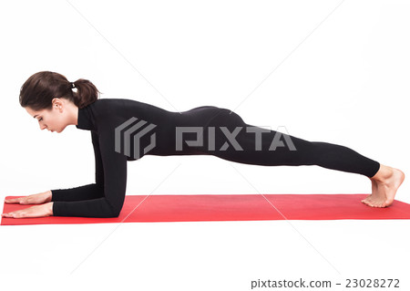 girl doing yoga. Kumbhasana asana plank pose girl doing yoga. Kumbhasana asana plank pose 23028272