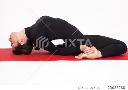 girl doing yoga. Matsiasana asana fish pose.  23028288