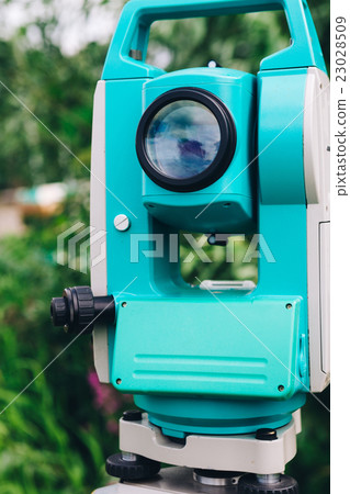 blue surveying equipment station background meadow 23028509