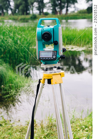 blue surveying equipment station background meadow 23028512