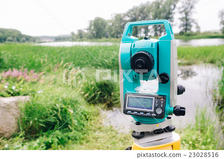 blue surveying equipment station background meadow 23028516