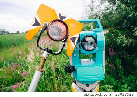 theodolite prism and blue surveying equipment  23028528