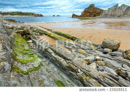 Portio Beach coastline landscape. 23028911