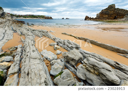 Portio Beach coastline landscape. 23028913