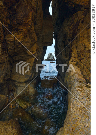 Seascape through slit in rock. 23028917