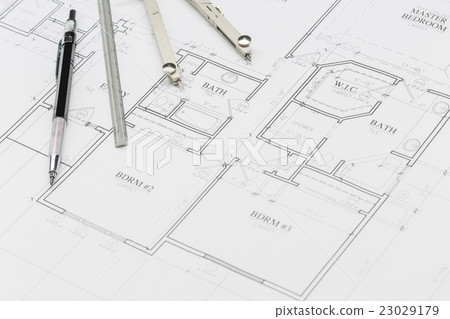 Pencil, Ruler and Compass Resting on House Plans Pencil, Ruler and Compass Resting on House Plans 23029179