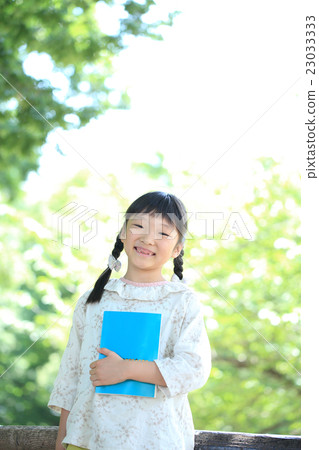 Elementary school girls with books 23033333