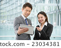 Men and women in business suit in a skyscraper 23034381