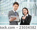 Men and women in business suit in a skyscraper 23034382