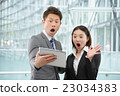 Men and women in business suit in a skyscraper 23034383
