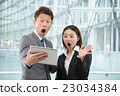 Men and women in business suit in a skyscraper 23034384