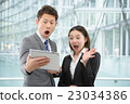 Men and women in business suit in a skyscraper 23034386