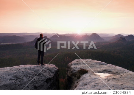 Hiker with sporty backpack.  Sunny spring daybreak 23034884