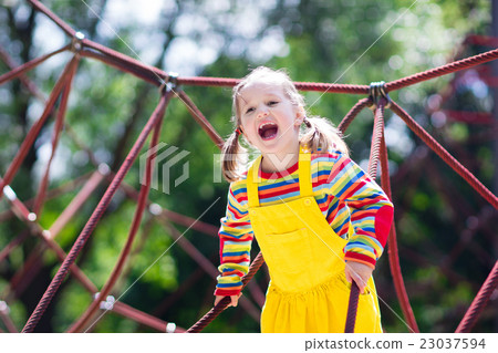 Child having fun on school yard playground 23037594