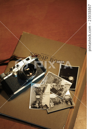 Old camera and scrapbook 23038867