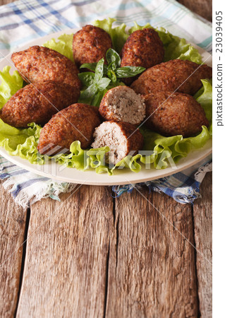 Hot kibbeh meatballs with bulgur and pine nuts 23039405