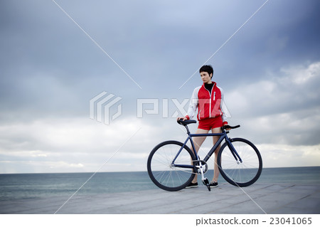Female with rental bike enjoying weekend stroll Female with rental bike enjoying weekend stroll 23041065