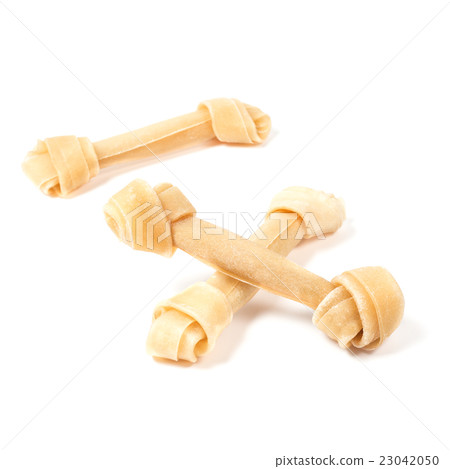 dog bone rawhide isolated on white 23042050