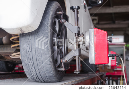 Close up shot of car wheel centering machine Close up shot of car wheel centering machine 23042234
