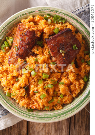 Pilaf bulgur and beef close-up on a plate 23042573