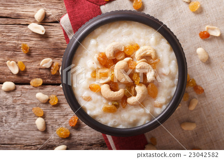Indian kheer rice pudding with nuts and raisins Indian kheer rice pudding with nuts and raisins 23042582