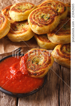 sliced potato rolls with tomato sauce close up 23042605