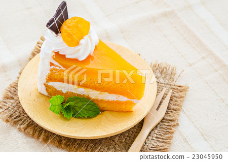orange cake with chocolate and topping. 23045950