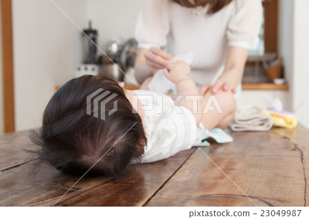 Mothers changing diapers 23049987