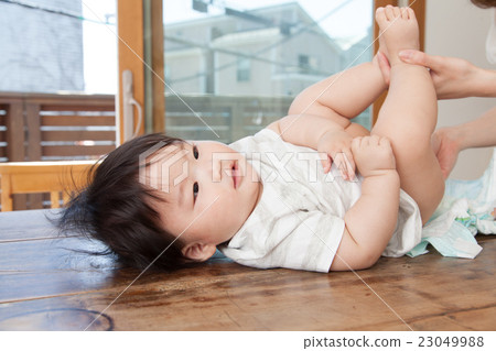Mothers changing diapers 23049988