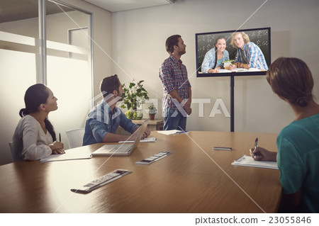 Composite image of college students doing homework in library 23055846