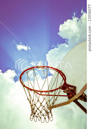 Basketball board and hoop with clouds background Basketball board and hoop with clouds background 23056077