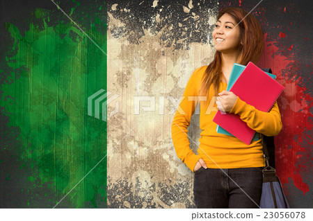 Composite image of female college student with books in park 23056078