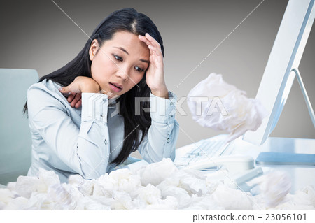 Composite image of unsmiling businesswoman with hands on face Composite image of unsmiling businesswoman with hands on face 23056101
