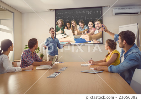 Composite image of college students gesturing thumbs up in libra Composite image of college students gesturing thumbs up in libra 23056392