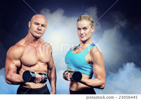 Composite image of portrait of muscular man and woman lifting du Composite image of portrait of muscular man and woman lifting du 23056445