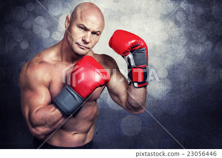 Composite image of portrait of boxer with red gloves 23056446