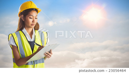 Composite image of architect woman with yellow helmet and plans 23056464
