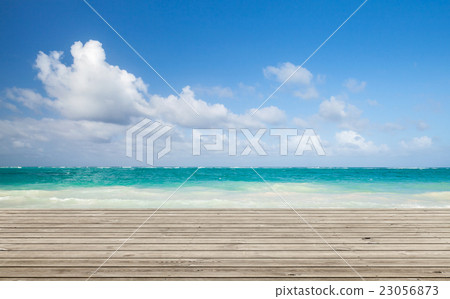 Wooden pier with bright ocean seascape 23056873