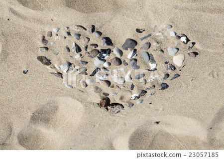 heart shape at the beach made out of pebbles heart shape at the beach made out of pebbles 23057185