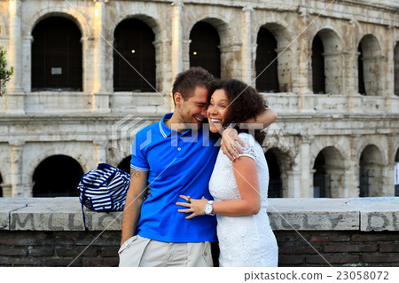 Young couple on the background of the Colosseum 23058072