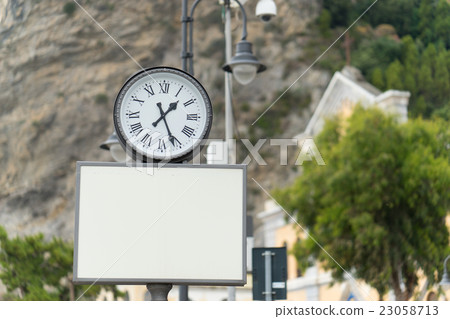 Blank billboard with analog clock 23058713