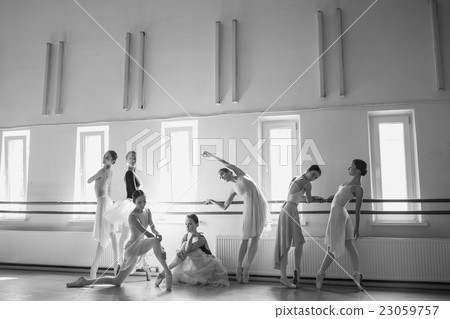 The seven ballerinas at ballet bar 23059757