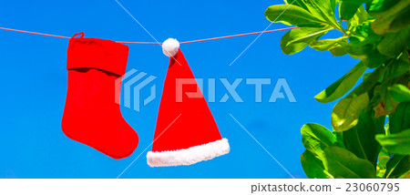 Christmas concept: santa hat and stocking Christmas concept: santa hat and stocking 23060795