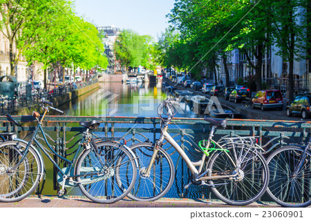 Colorful bikes on the bridge in Amsterdam 23060901