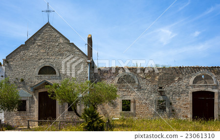 small old church attached to a farm 23061310